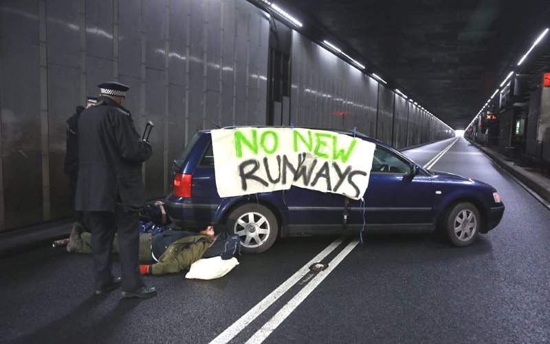 photo of Rising Up! protest blockades Heathrow airport image