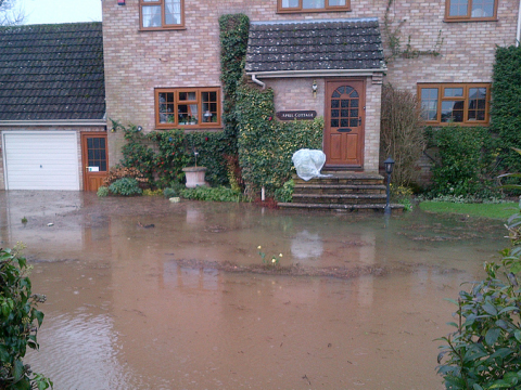 A flooded home, recently built, at Severn Stoke, Worcester. Photo: Dave Throup.