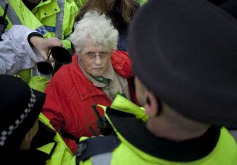 Anne Power surrounded by police at an anti-fracking protest at Barton Moss, December 2013. Photo: Steven Speed / SalfordStar.com.