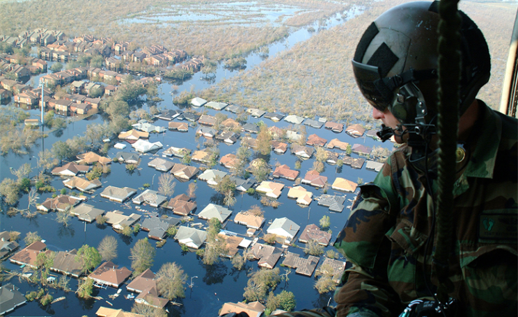 Helicopter passenger looks down over flooded city