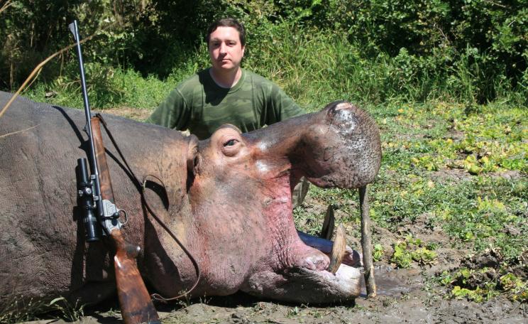 Trophy hunter with hippo