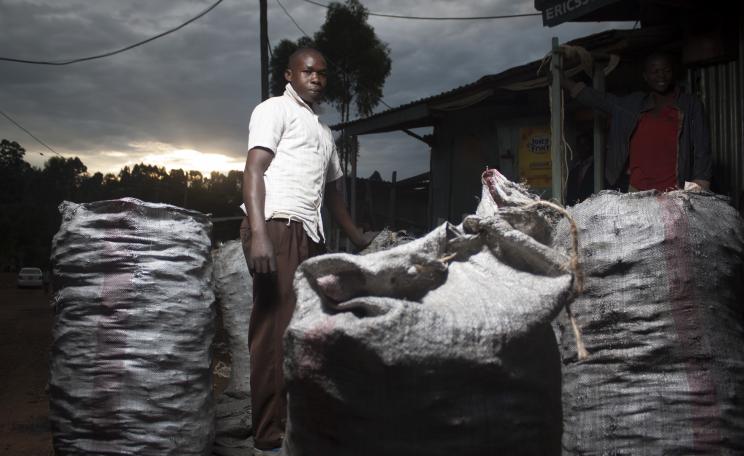 Young man selling charcoal in Kisii, southwest Kenya