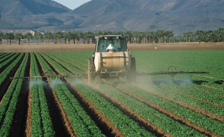 Spraying pesticides