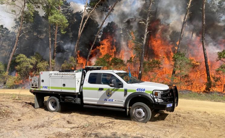 A brush truck from Merrit Island National Wildlife Refuge provides support on the Major Fire in Florida. Photo by National Forests in Florida.