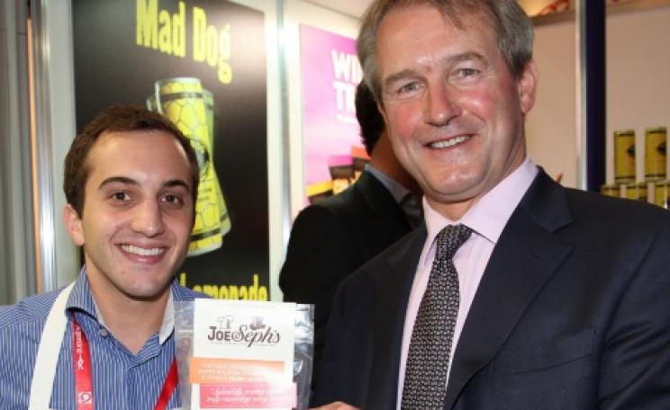 Owen Paterson MP with Joe & Sephs Gourmet Popcorn. The 'Mad Dog' sign refers to a brand of lemonade. Photo: UKTI via Flickr.