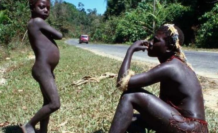A Jarawa woman and boy by the side of the Andaman Trunk Road. Photo: © Salomé / Survival.