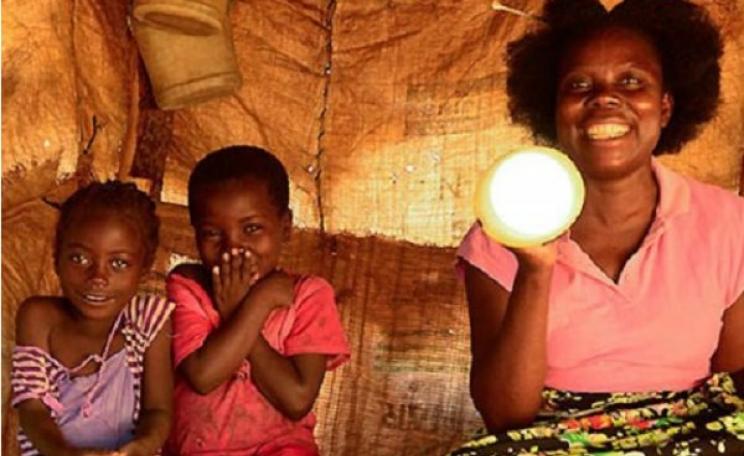 Happy family - pleased to enjoy solar lighting for the first time. Photo: SunneyMoney.