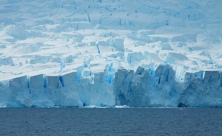 Where ice meets ocean - Antarctic coastline by McKay Savage via Flickr (CC BY 2.0).