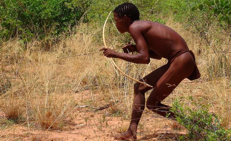 A San 'Bushman' hunter wıth bow and arrow. Photo: Charles Roffey via Flickr (CC BY-NC-SA 2.0).
