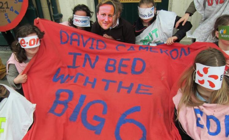 Protesters at David Cameron's constituency office - accusing him of being in bed with the UK's energy oligarchs at the expense of people and climate. Photo: Zoe Broughton.