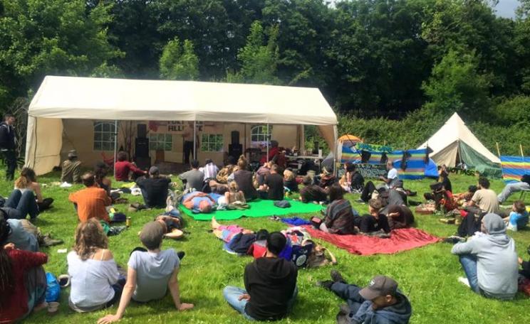 A rave? People gather to hear a lecture at the Democracy Festival near Runnymede yesterday. Photo: John Phoenix via Facebook.