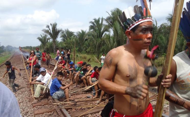 Some 300 indigenous Guajajara and Awá-Guajá people blockade the Carajás railroad in October 2012 to call for the repeal of Brazil's Ordinance 303, which abolished the need for indigenous consultation for major infrastructure projects deemed integral to