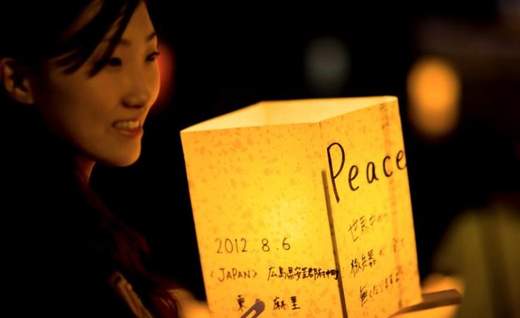 A young woman participates in Hiroshima's lantern floating ceremony on the Motoyasu River that runs below the Atomic Bomb Dome, 6th August 2012. Photo: Freedom II Andres via Flickr (CC BY).