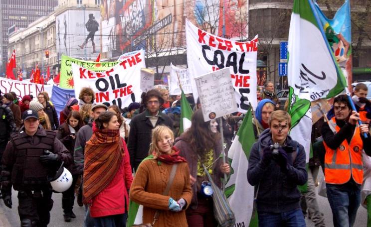 COP19 Climate March against the influence of fossil fuel companies on the negotiations, November 16 2013. Photo: Jamie Henn / 350.org via Flickr (CC BY-NC-SA).