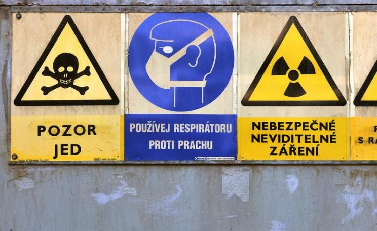 Radioactive warning signs at a Czech processing plant storage facility where 'yellowcake' uranium ore is processed. Photo: IAEA Imagebank via Flickr (CC BY-SA).