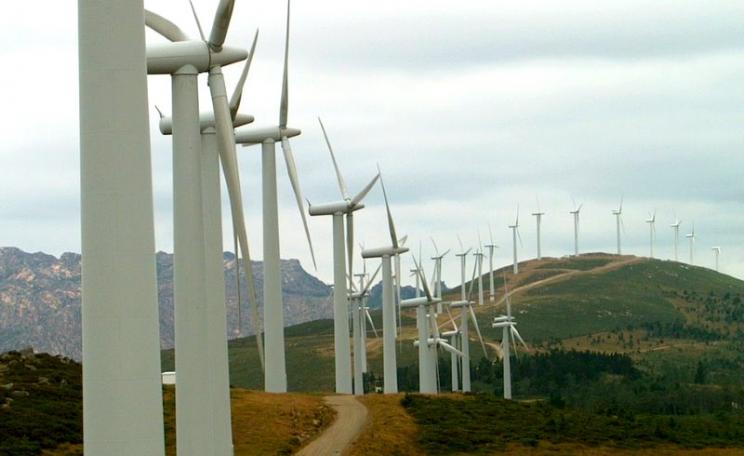 Wind turbines along a mountain ridge in Galicia, Spain. Photo: Luis Alves via Flickr (CC BY).