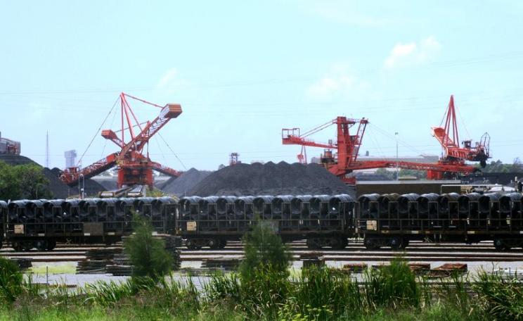 The city of Newcastle, Australia, home to the world's biggest coal port, is among those to join the divestment movement. Port Waratah Coal Loader and freight train carrying steel. Photo: OZinOH via Flickr (CC BY-NC).