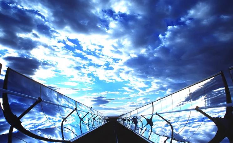 Parabolic Trough Collectors in New Mexico, USA. They work by concentrating the sun's rays on an oil-filled tube running along the focal line of the trough. Photo: Randy Montoya / Sandia Labs via Flickr (CC BY-NC-ND).
