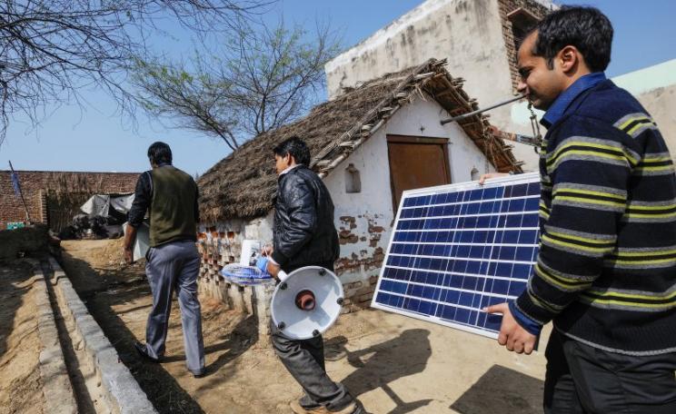 We need renewable energy deployment now! Simpa Networks technicians in Sonsa Village, Mathura Uttar Pradesh. Photo: Asian Development Bank via Flickr (CC BY).
