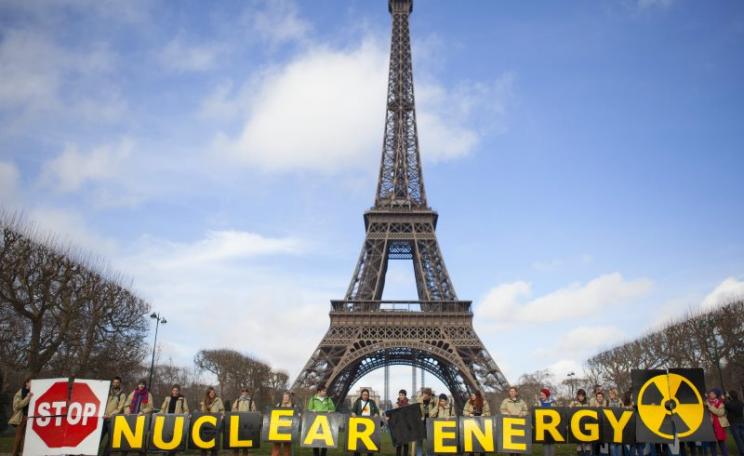 'Stop nuclear energy! - demonstration on the Champs de Mars, Paris, in front of the Eiffel Tower. Photo: GLOBAL 2000 via Flickr (CC BY-ND).