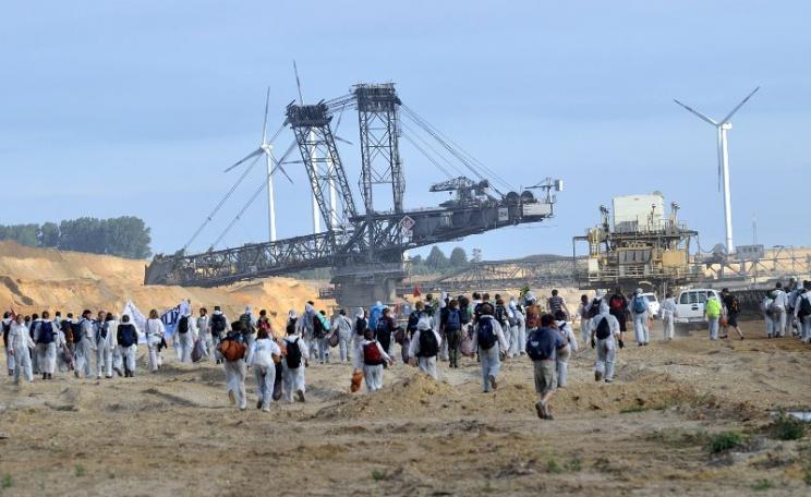 On 15th August 2015 climate protestors in Germany occupied and closed down a massive open pit coal mine in their 'Ende Gelände' action. Photo: Tim Wagner / 350.org via Flickr (CC BY).