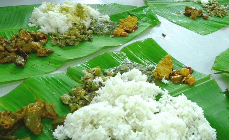 Most rice-eating peoples like their rice white - and will avoid yellow rice as the colour is an indicator of the deadly mould that causes beri-beri disease. Photo: rice and curry on banana leaf in Riau, Indonesia, by John Walker via Flickr (CC BY).