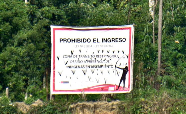 'Entry forbidden - Law number 26834 - Law number 28736 - Zone of restricted access owing to the presence of indigenous peoples living in isolation'. Sign in the Manu National Park, Peru. Photo: oarranzli via Flickr (CC BY-ND).