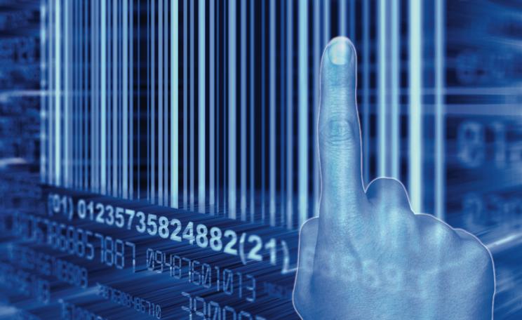 Finger pointing at a barcode