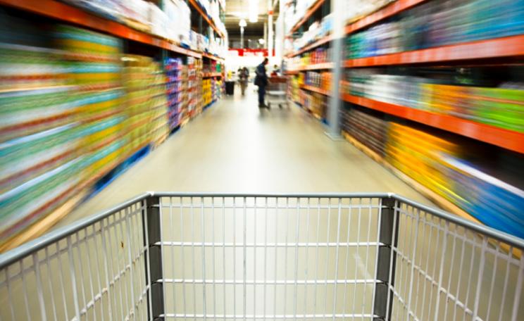 Wheeling a shopping trolley around a supermarket