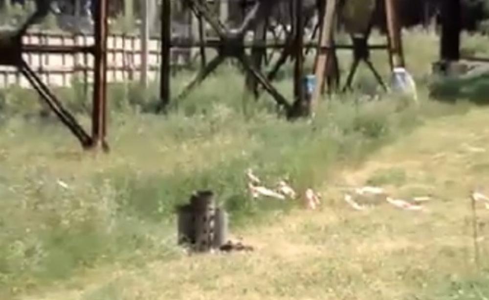A still from YouTube video by SputnikTV allegedly shows remains of a shell near the facilities of Gorlovka chemical plant in eastern Ukraine.