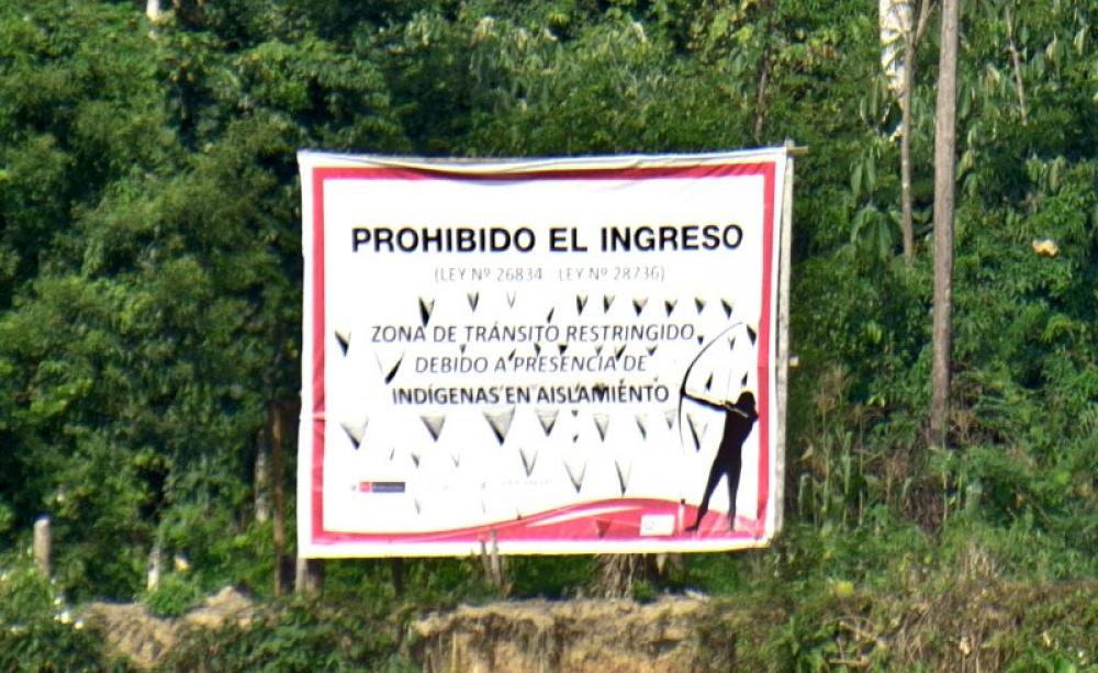 'Entry forbidden - Law number 26834 - Law number 28736 - Zone of restricted access owing to the presence of indigenous peoples living in isolation'. Sign in the Manu National Park, Peru. Photo: oarranzli via Flickr (CC BY-ND).
