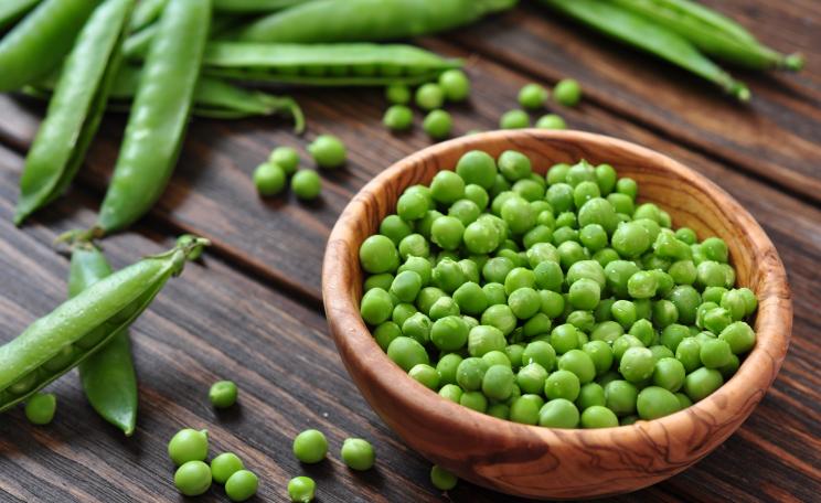 Peas in a wooden bowl