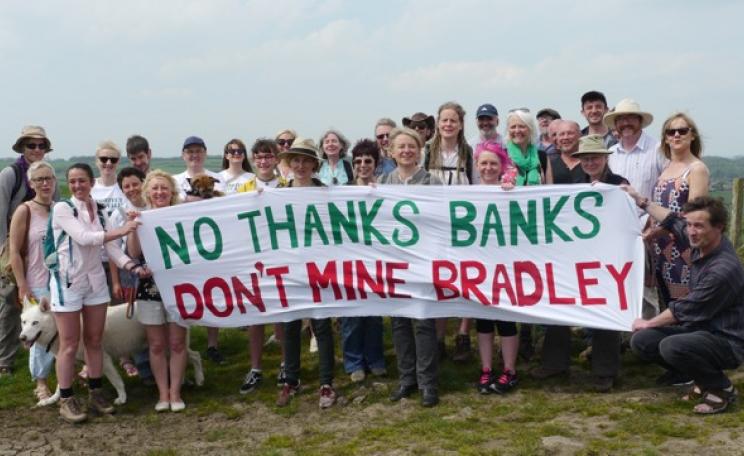 Protesters in countryside with banner saying 'No thanks Banks, don't mine Bradley'. 