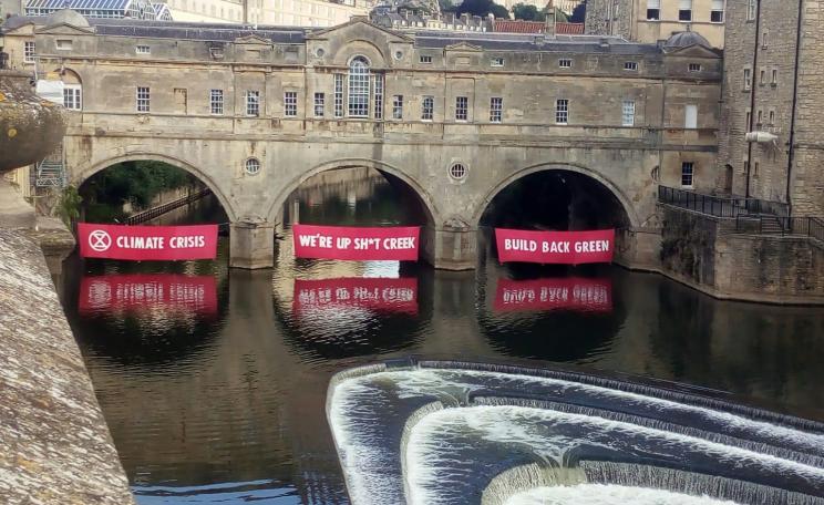 XR unfurls banners in Bath - the government is not heeding warnings on climate change, it says