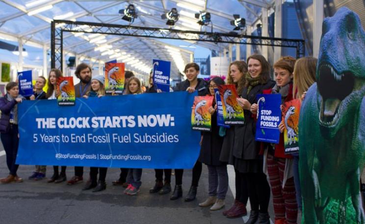 Pop-up protest at COP21 today at the Le Bourget Conference Centre: 'Five years to end fossil fuel subsidies!' Photo: stopfundingfossils via Flickr (CC BY-NC-SA).